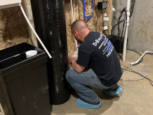 ray working on a water softener system